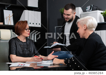 Office workers discuss their project over Cup of tea 46985264