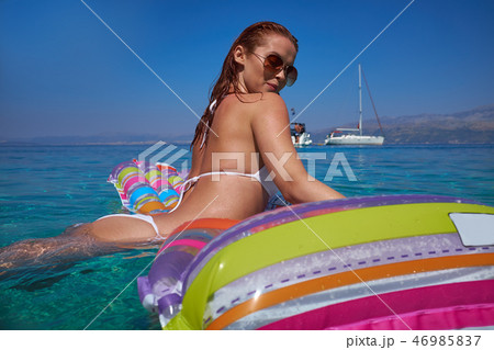 Beautiful Young Girl Floating On A Mattress In The Sea Stock Pho Beautiful Young Girl Floating On A Mattress In The Sea Stock Pho 46985837