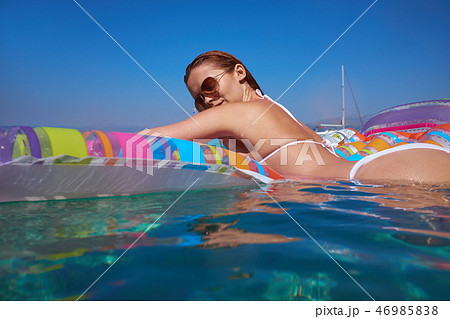 Beautiful Young Girl Floating On A Mattress In The Sea Stock Pho Beautiful Young Girl Floating On A Mattress In The Sea Stock Pho 46985838