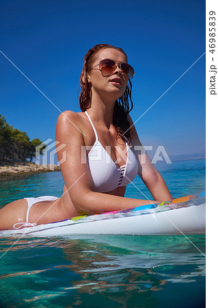 Beautiful Young Girl Floating On A Mattress In The Sea Stock Pho Beautiful Young Girl Floating On A Mattress In The Sea Stock Pho 46985839