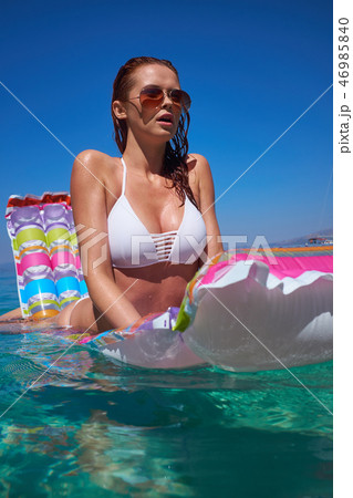 Beautiful Young Girl Floating On A Mattress In The Sea Stock Pho 46985840