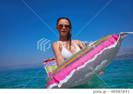 Beautiful Young Girl Floating On A Mattress In The Sea Stock Pho Beautiful Young Girl Floating On A Mattress In The Sea Stock Pho 46985841