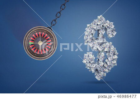 3d rendering of a large casino roulette swings on a metal chain ready to destroy a large dollar sign 3d rendering of a large casino roulette swings on a metal chain ready to destroy a large dollar sign 46986477