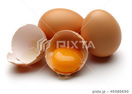 Broken egg on white background Broken egg on white background 46986690