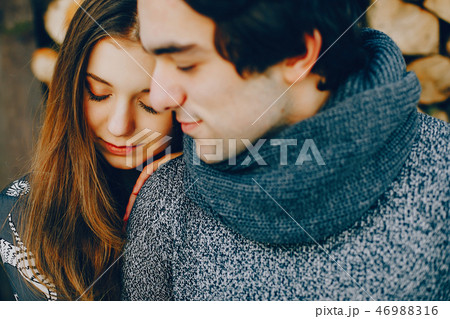 Loving couple standing in a winter park 46988316