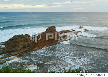 Magnific big rock in ocean 46990211