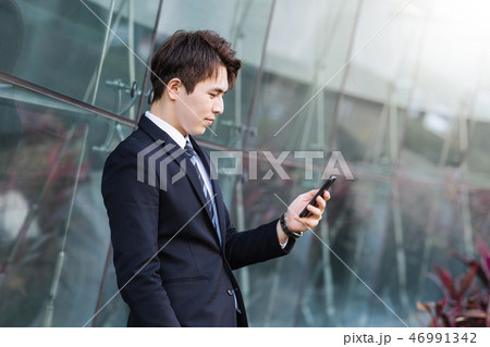 Business man using the smart phone  46991342