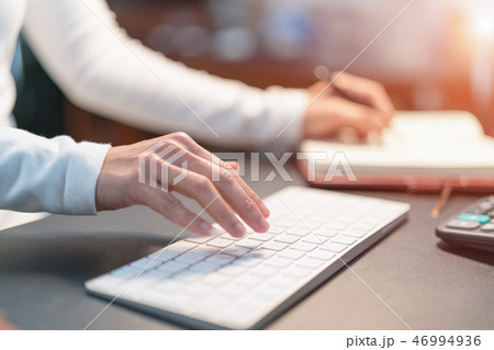 financial advisor typing on keyboard at office 46994936