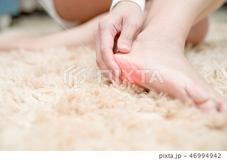 foot ankle injury pain woman touch foot painful 46994942