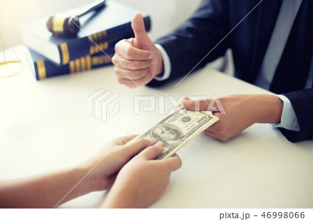 Judge lawyer gavel with bribe money in law firm 46998066