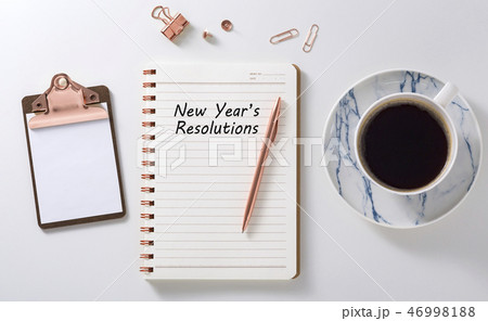 New year resolutions on notebook with coffee cup 46998188