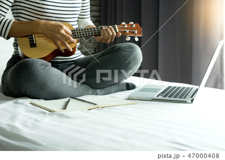 young woman write a song or music young woman write a song or music 47000408