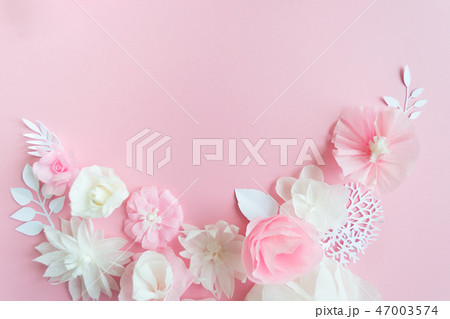white and pink paper flowers on the pink background 47003574
