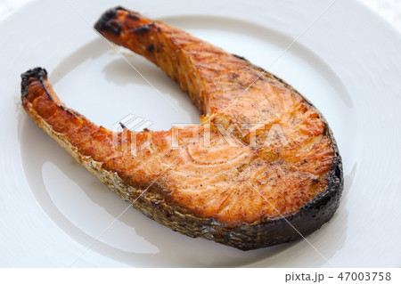 Grilled Salmon fish on the white plate 47003758