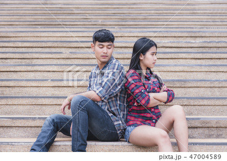 attractive angry couple fighting at each other. 47004589