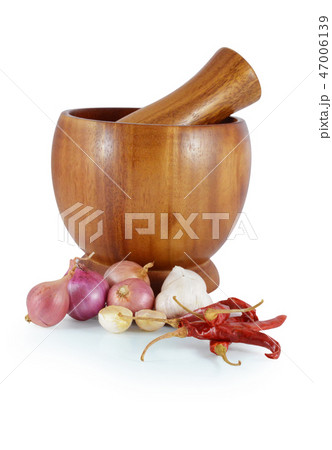 fresh flavoring herbs and spices in wooden mortar fresh flavoring herbs and spices in wooden mortar 47006139