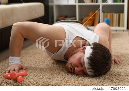 A young handsome man with excess weight 47008921