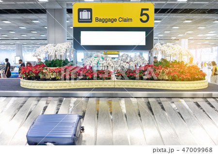 Luggage claim waiting at airport. Luggage claim waiting at airport. 47009968