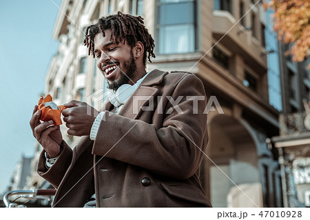 Happy young man going to eat cake Happy young man going to eat cake 47010928