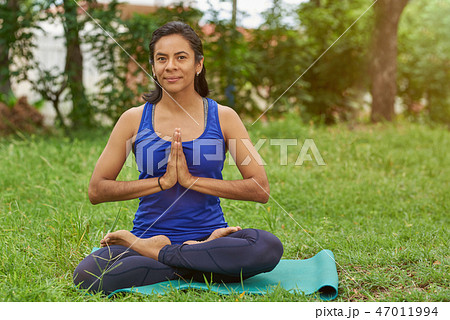 Woman in lotus pose Woman in lotus pose 47011994