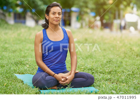Young woman sit in relax pose Young woman sit in relax pose 47011995