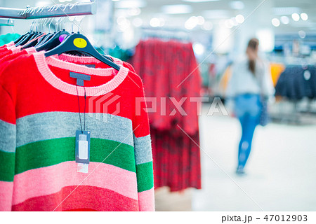 Clothing on hanger at modern shop, mass market. Clothing on hanger at modern shop, mass market. 47012903