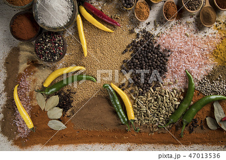 Variety of spices and herbs on kitchen table Variety of spices and herbs on kitchen table 47013536
