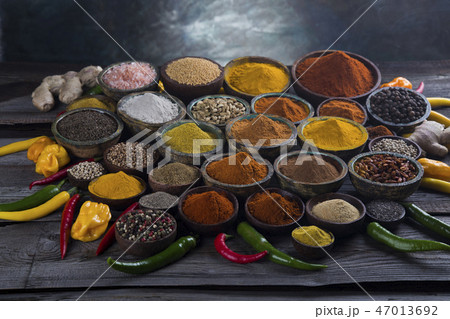 Assortment of spices in wooden bowl background Assortment of spices in wooden bowl background 47013692