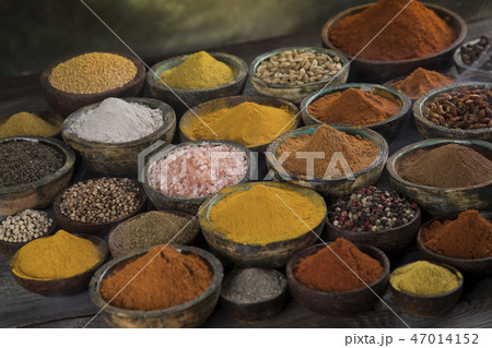 Assortment of spices in wooden bowl background Assortment of spices in wooden bowl background 47014152