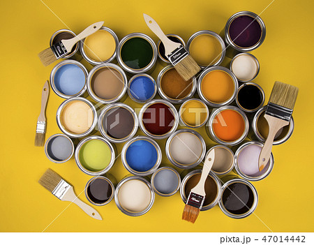 Tin cans with paint and brushes, yellow background 47014442