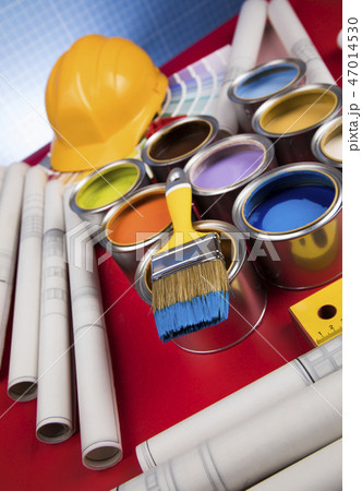 Can with paint and paintbrush, red background 47014530