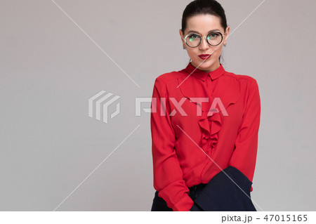 Horizontal Portrait of a beautiful girl in bright business clothes isolated on a light background Horizontal Portrait of a beautiful girl in bright business clothes isolated on a light background 47015165