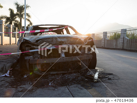 closeup of a burned out car on roadside closeup of a burned out car on roadside 47019436