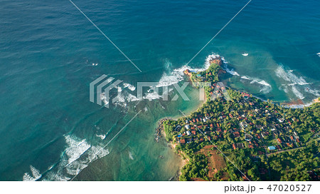 aerial view of coastline and fisherman village 47020527