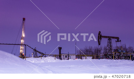 Oilfield in winter night time Oilfield in winter night time 47020718