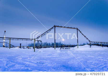 Oilfield in winter night time Oilfield in winter night time 47020721
