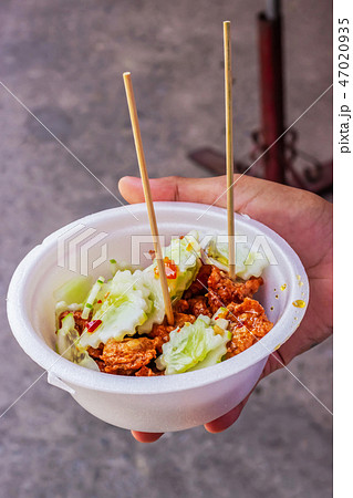 Tod Mun Kala in foam cup, Thai cuisine. Tod Mun Kala in foam cup, Thai cuisine. 47020935