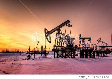 Oilfield during sunset in winter time 47021328