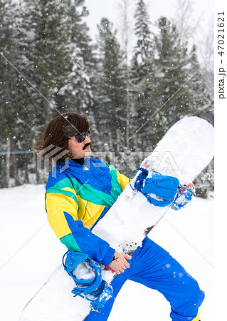 Vintage photo of young man snowboarder 47021621