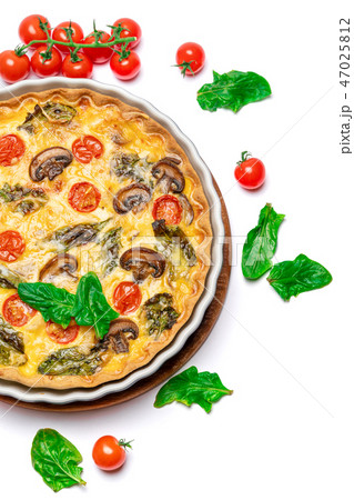 Baked homemade quiche pie in ceramic baking form 47025812