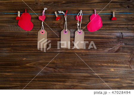 Red heart message with chalk card with red hearts on brown wooden background. Valentines Day concept Red heart message with chalk card with red hearts on brown wooden background. Valentines Day concept 47028494