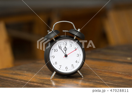 Retro clock with five minutes to twelve o'clock. Retro clock with five minutes to twelve o'clock. 47028811