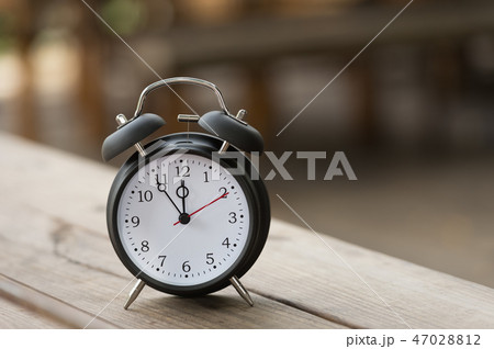 Retro clock with five minutes to twelve o'clock. Retro clock with five minutes to twelve o'clock. 47028812