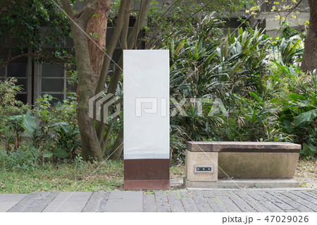 Large blank billboard on a street wall 47029026