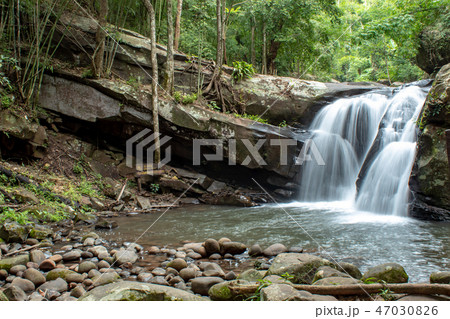 Waterfall flowing from the mountains. Waterfall flowing from the mountains. 47030826