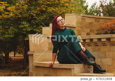 Cute girl in autumn park 47031908