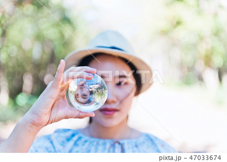 Beautiful woman hold crystal ball and can see  47033674