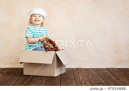 Happy child playing at home Happy child playing at home 47034888