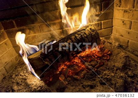 log is burning in fireplace log is burning in fireplace 47036132