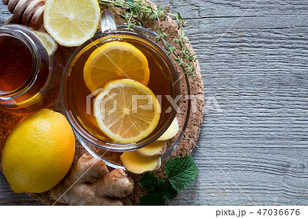 A cup of tea with ginger, lemon, melissa and honey A cup of tea with ginger, lemon, melissa and honey 47036676